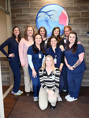 Ashe Women &amp; Children&apos;s Health Staff, smiling. There is nine females.
