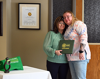 Picture of Kim Harris holding  a certificate, a DAISY Award, pin, and a meaningful sculpture.
Kim Harris, a licensed practical nurse (LPN), was recently selected as Ashe Memorial Hospital&#x2019;s next DAISY Award winner.