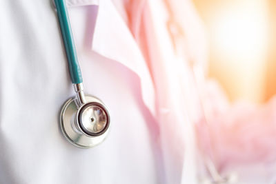 Picture of a Stethoscope hanging around a physicians neck