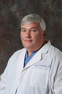 Picture of smiling Dr. Robert Grajewski. He is an experienced physician, specializing in minimally invasive approaches to complex urological problems, including laser surgery, cryoablation and lithotripsy. Located on the campus of Ashe Memorial Hospital, Ashe Urology offers both non-invasive and minimally invasive treatment of urological problems.