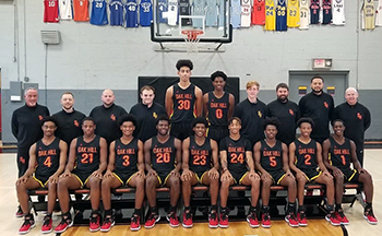 Oak Hill Academy Basketball team group picture on the basketball court.
