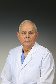 Headshot of male physician wearing white coat